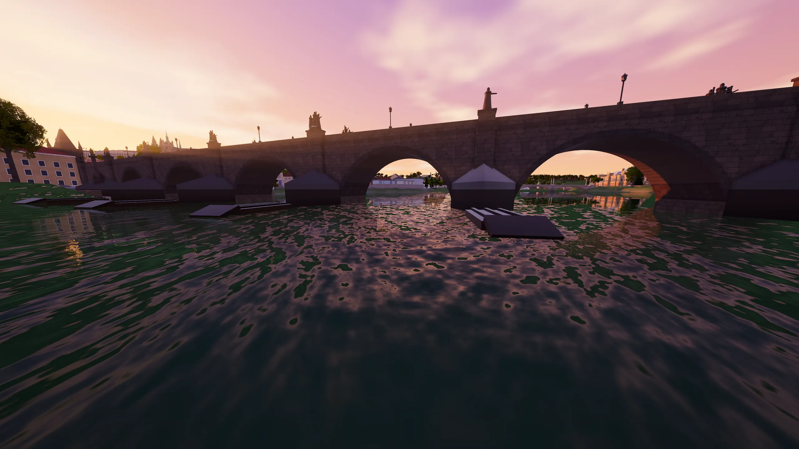Low over the Vltava, lining up a bridge arch at sunset